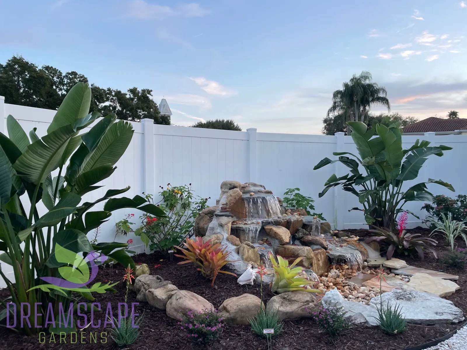 Landscape with water feature and tropical backdrop — South Florida