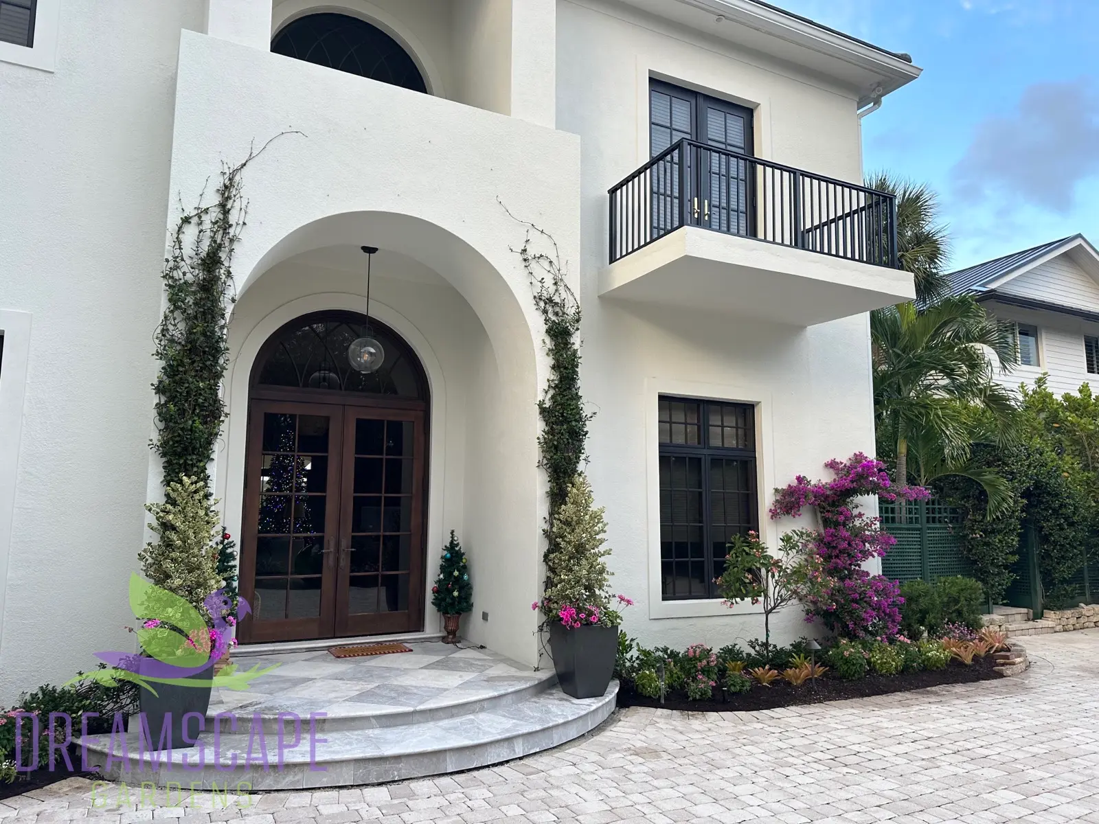 Pool area landscape — tropical planting with specimen palms and pavers